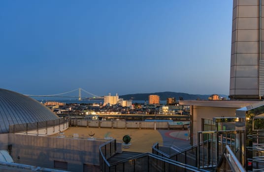 Akashi, Japan - April 19, 2023: View of bridge and train station from observation point at Akashi Planetarium. High quality photo