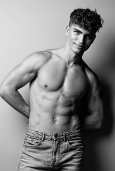 man fitness jeans black and white studio stylish body fit caucasian strong bicep white sexy beauty