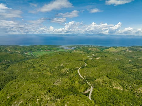 Aerial drone of farmland on the slopes of hills in the mountainous region. Negros, Philippines
