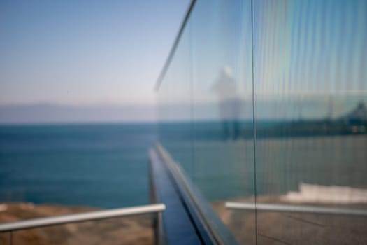 Panoramic view of the city. An observation deck with a figured fence and a lantern. City view.