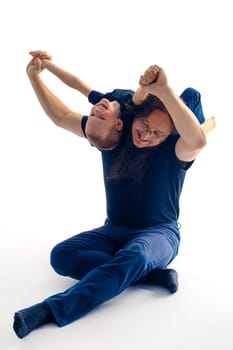 young handsome father with his son fooling around, lifestyle on white background. High quality photo