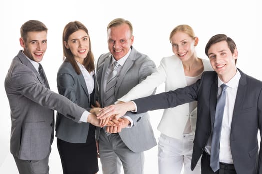 Business people colleagues stacking hand to cooperate, studio isolated on white background