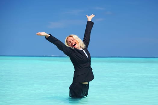 business woman stay in ocean waves