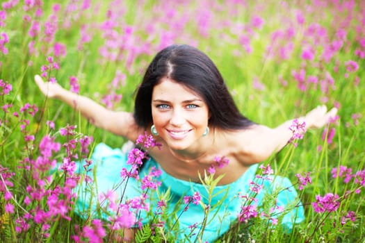  woman on pink flower field close portrait