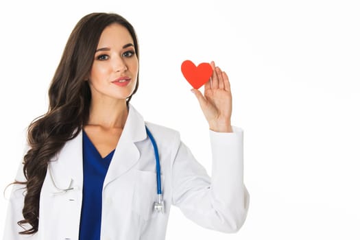 Smiling doctor woman holding heart shape paper