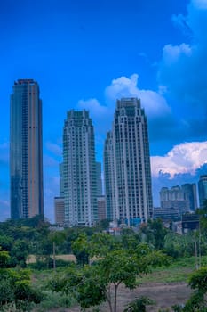 Jakarta, Indonesia. April 23, 2023. The street with high buildings and the light traffic during Eid Holidays. Street Photography.