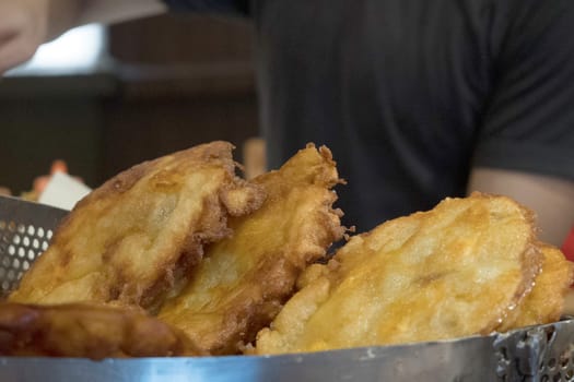 The fried cempedak which is the fruit similar with jackfruit but with strong smell and softer. Covered with flour. Food photography.
