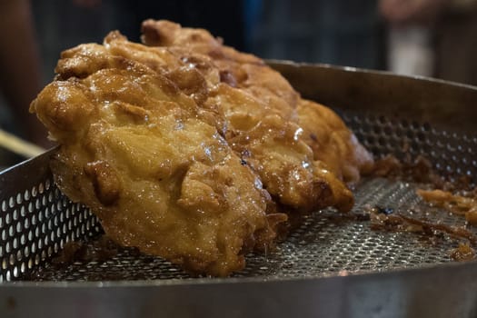 The fried cempedak which is the fruit similar with jackfruit but with strong smell and softer. Covered with flour. Food photography.