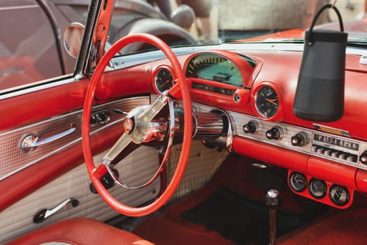 PARIS, FRANCE - MAY, 15, 2022: Leather interior of red Ford Thunderbird 1956