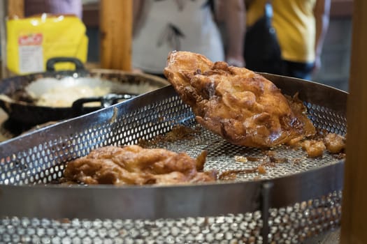 The fried cempedak which is the fruit similar with jackfruit but with strong smell and softer. Covered with flour. Food photography.