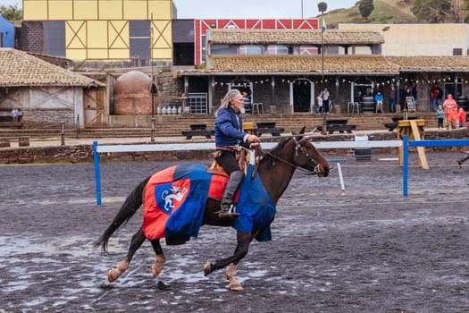 BALLARAT, AUSTRALIA - April 7 2023: Medieval horse show at the popular tourism destination of Kryal Castle which is a medieval village near the country Victorian town of Ballarat on a stormy autumn morning