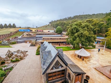 BALLARAT, AUSTRALIA - April 7 2023: The popular tourism destination of Kryal Castle which is a medieval village near the country Victorian town of Ballarat on a stormy autumn morning