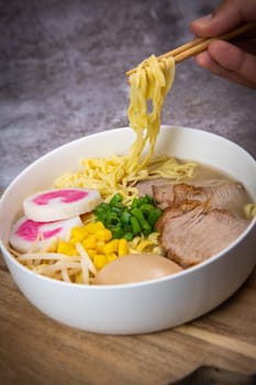 Fresh ramen noodles with garnish, pork tenderloin, eggs marinated in Mirin and soy sauce, bean sprouts, corn, nori leaf, spring onion, and homemade Narutomaki with codfish back, Hight quality