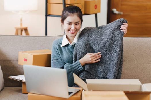 Small businesses SME owners female entrepreneurs check online orders to prepare to pack the boxes, sell to customers, sme business ideas online.