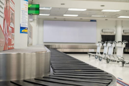 Baggage claim at the airport, empty baggage claim room, conveyor belt at the airport. High quality photo