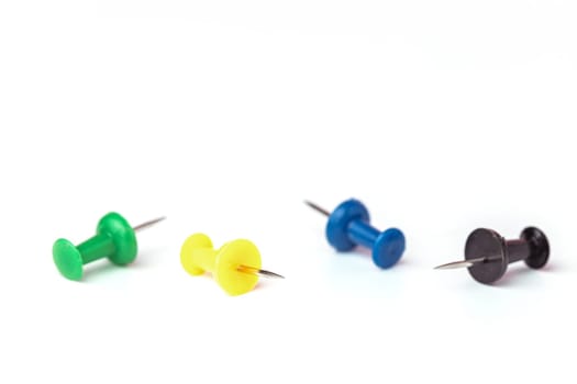 Push pins on white background for the concept of office and school stationary object.