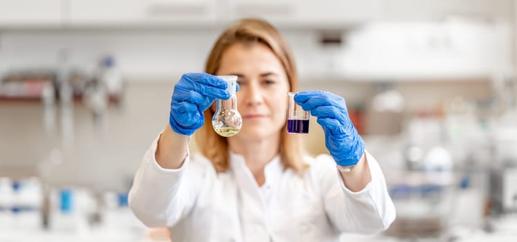 female scientist is experimenting in a biochemical research laboratory.