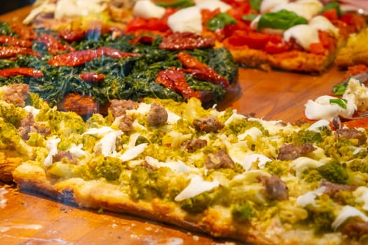 Tasty pizza with broccoli, meat, and cheese for sale