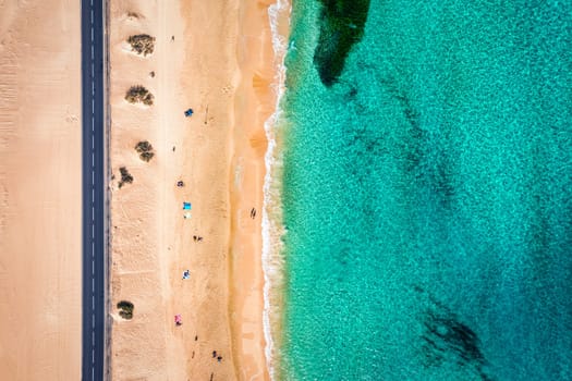 Aerial view of beach in Corralejo Park, Fuerteventura, Canary Islands. Corralejo Beach (Grandes Playas de Corralejo) on Fuerteventura, Canary Islands, Spain. Beautiful turquoise water and white sand.