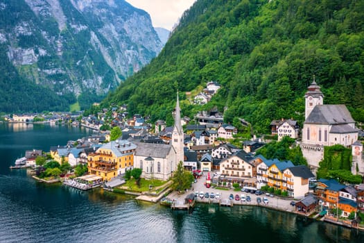 Aerial view of austrian mountain village Hallstatt and Hallstatter lake. Beautiful summer time. Salzkammergut, Austria. Hallstatt village over Hallstatter See, in Salzkammergut, Austria.