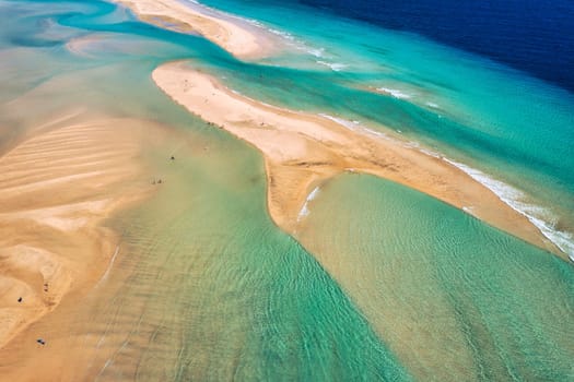 Jandia Peninsula, Risco del Paso, Playas de Sotavento and Laguna de Sotavento, Fuerteventura, Canary Islands, Spain, Atlantic, Europe. Kitesurfing flying in the ocean, Sotavento beach, Fuerteventura