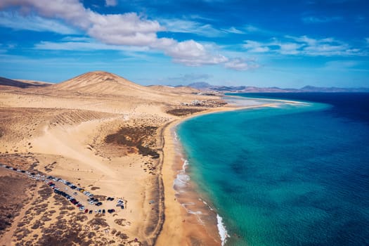 View on the beach Sotavento with golden sand and crystal sea water of amazing colors on Costa Calma on the Canary Island Fuerteventura, Spain. Beach Playa de Sotavento, Canary Island, Fuerteventura.