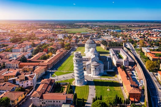 Pisa Cathedral and the Leaning Tower in a sunny day in Pisa, Italy. Pisa Cathedral with Leaning Tower of Pisa on Piazza dei Miracoli in Pisa, Tuscany, Italy.