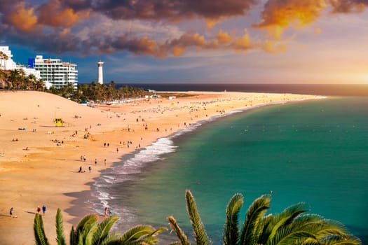 Morro Jable, Fuerteventura, Spain. Breathtaking beach Playa del Matorral in the rays of the sunset. Morro Jable and Playa del Matorral, Fuerteventura, Canary Islands, Spain, Atlantic, Europe