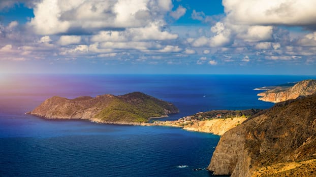 Assos village in Kefalonia, Greece. Turquoise colored bay in Mediterranean sea with beautiful colorful houses in Assos village in Kefalonia, Greece, Ionian island, Cephalonia, Assos village.