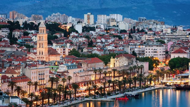 Amazing Split city waterfront panorama at blue hour, Dalmatia, Europe. Roman Palace of the Emperor Diocletian and tower of Saint Domnius cathedral. Split, Croatia. 