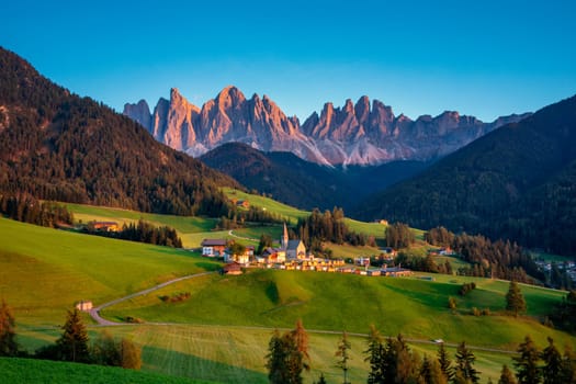 Santa Maddalena (Santa Magdalena) village with magical Dolomites mountains in background, Val di Funes valley, Trentino Alto Adige region, South Tyrol, Italy, Europe. Santa Maddalena Village, Italy. 