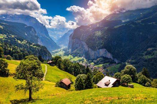 Famous Lauterbrunnen town and Staubbach waterfall, Bernese Oberland, Switzerland, Europe. Lauterbrunnen valley, Village of Lauterbrunnen, the Staubbach Fall, and the Lauterbrunnen Wall in Swiss Alps.