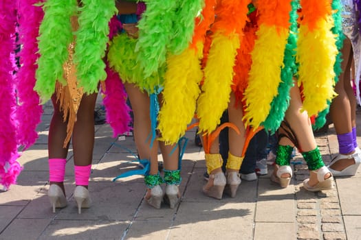 The beautiful legs of women dancers of the Pacific and caribbean beach