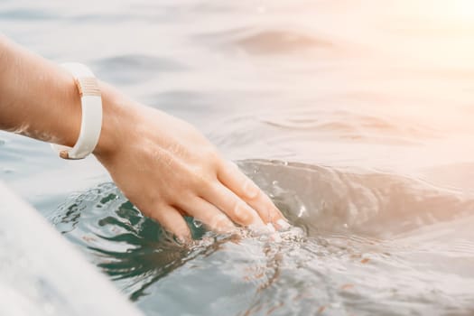 Woman in kayak back view. Happy young woman with long hair floating in transparent kayak on the crystal clear sea. Summer holiday vacation and cheerful female people having fun on the boat.