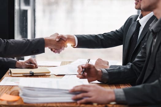 Business people handshake. Successful businessmen handshaking after good deal. Finishing up meeting concept.