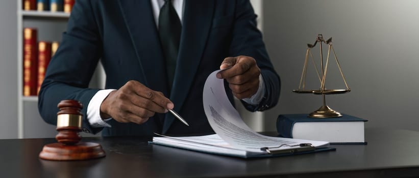 Close up lawyer businessman working or reading lawbook in office workplace for consultant lawyer concept...