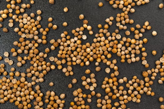 Macro shot of coriander seeds. Organic food, healthy lifestyle. Medicinal herbs and spices