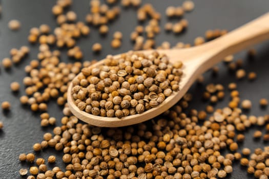 Macro shot of coriander seeds. Organic food, healthy lifestyle. Medicinal herbs and spices