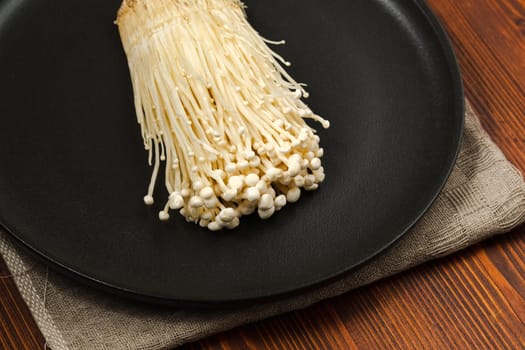 Popular in asian cuisine fresh needle mushroom or enoki, enokitake Flammulina velutipes.