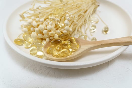 Mushroom or enoki medical use, dietary supplements, pills capsules. Golden needle mushroom.