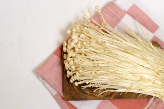 Enoki mushroom close up macro, Golden needle mushroom, used i food and salads.