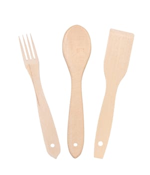 Wooden spoon, fork and spatula on a white isolated background