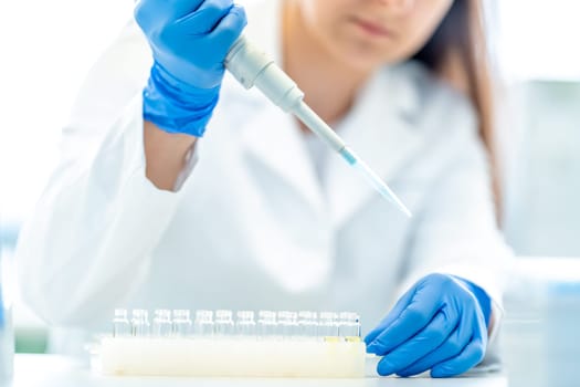 a student of the university science faculty conducts biochemical research in the laboratory. High quality photo