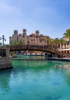 Waterway with old wooden bridge in the Souk Madinat Junction mall