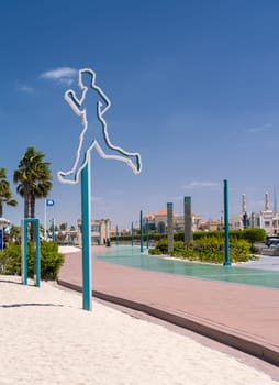 Jogging sign for the green Zero Point running track at Jumeirah public beach in Dubai UAE