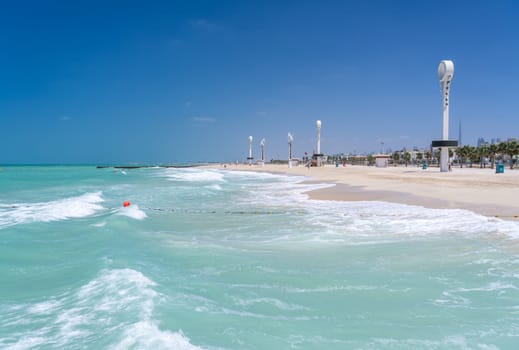 Towers with floodlights and lighting for night swimming at Jumeirah Wild Beach in Dubai