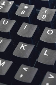 Black computer keyboard keys close up, background for text