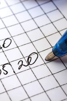Writing date with pen on white paper close up