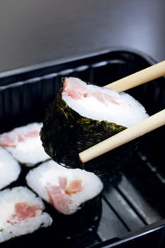 Japanese rolls and sticks on a wooden table