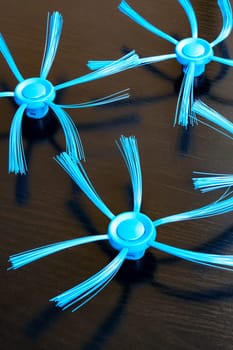 Blue brushes for the robot vacuum cleaner close up